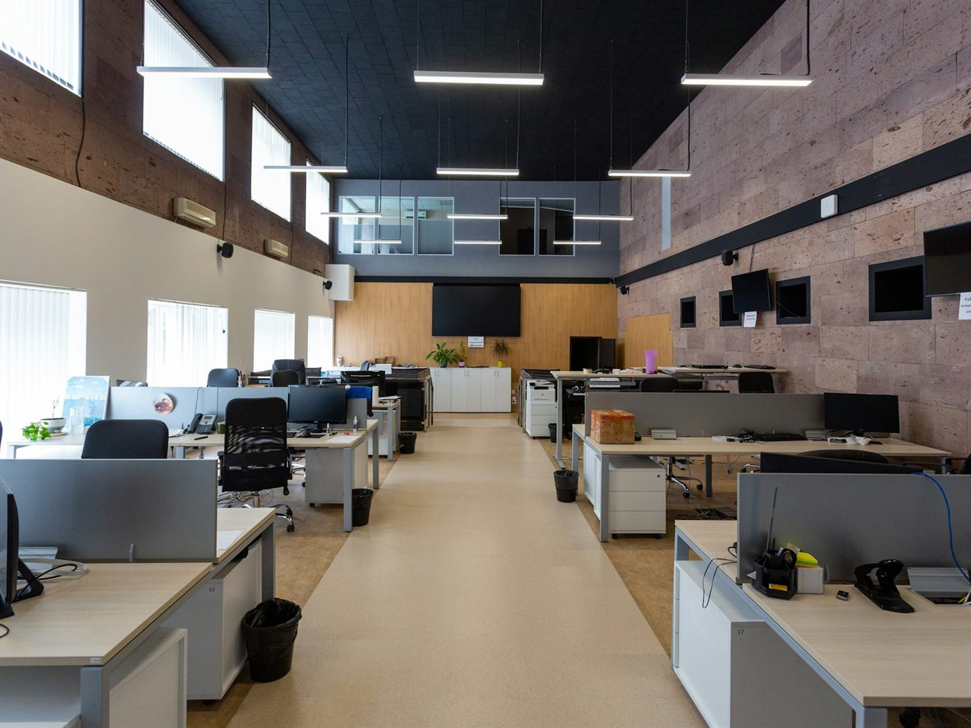 Open plan office with clean desks and floors, illustrating commercial and office cleaning