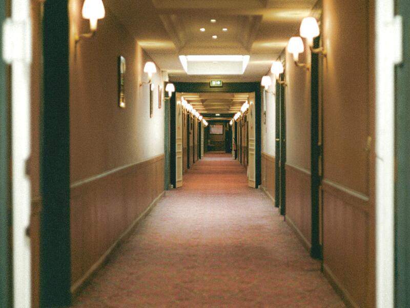 Building corridor with elevators, illustrating cleaning of common areas