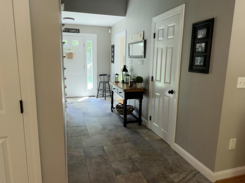 Entry hall and tile floor cleaned by AJ Premium Cleaners, ready for the new residents